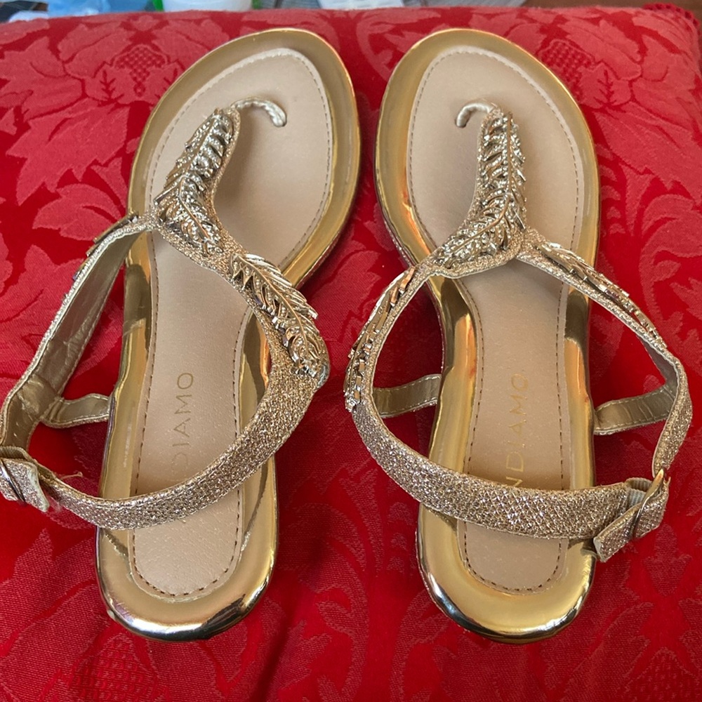 Gold sandals size 7 medium. Worn a couple of times.